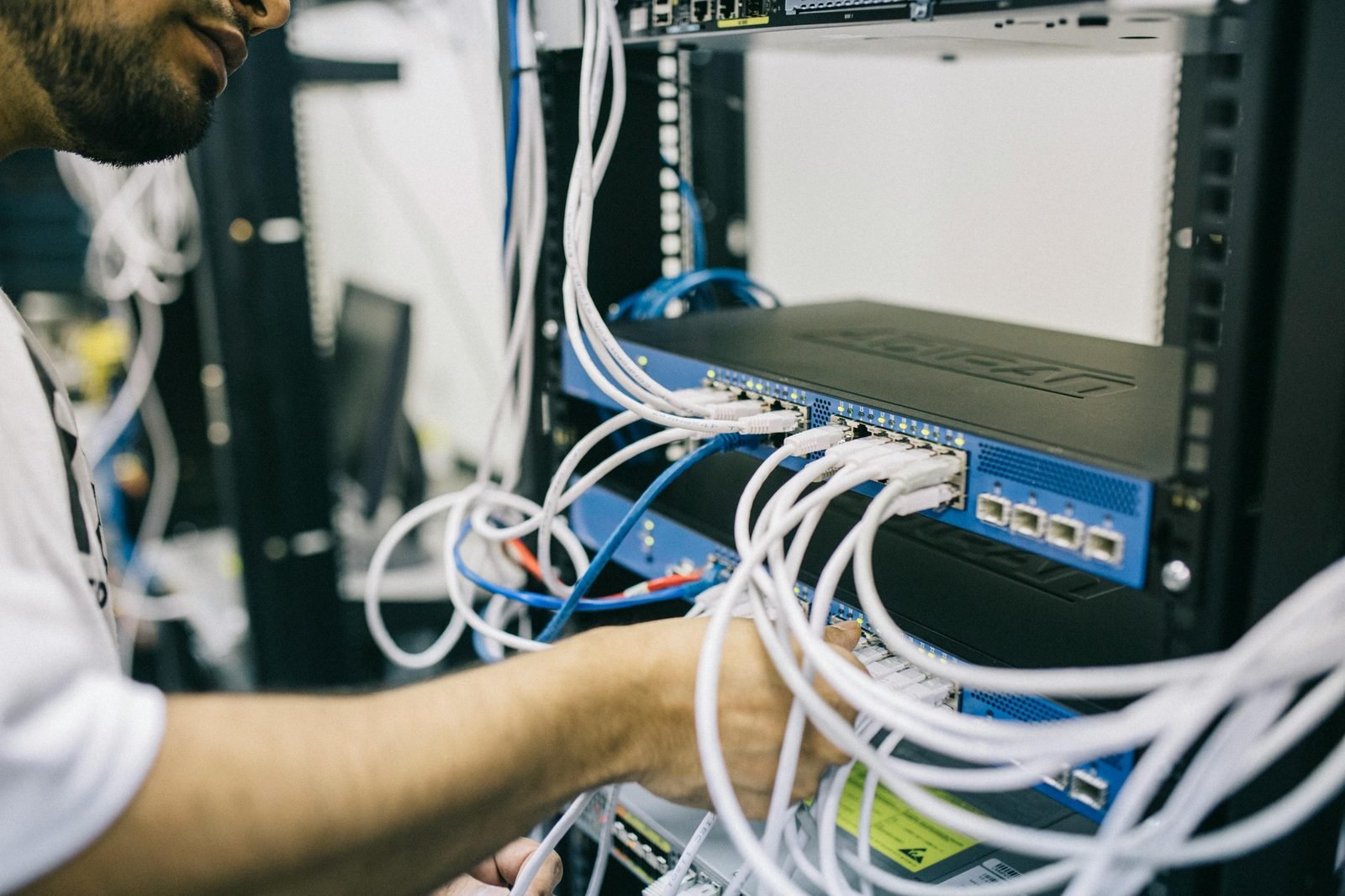 Certified FalconNet engineer configuring a home network panel in a UAE villa